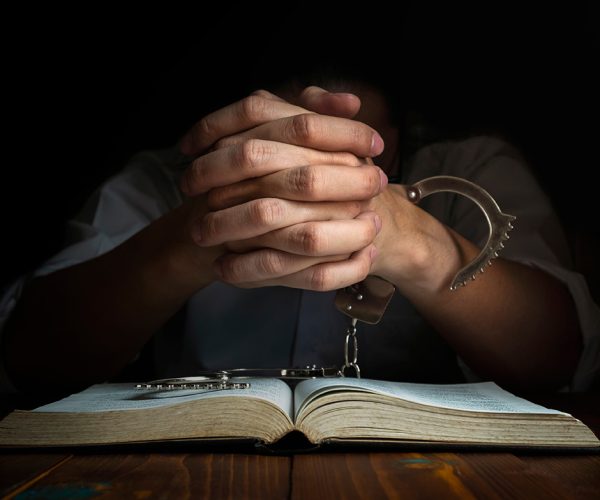 Handcuffs and the Holy Bible. Concept Picture of Someone Who Released From Sin by the God Words.